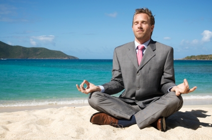 man on beach meditating