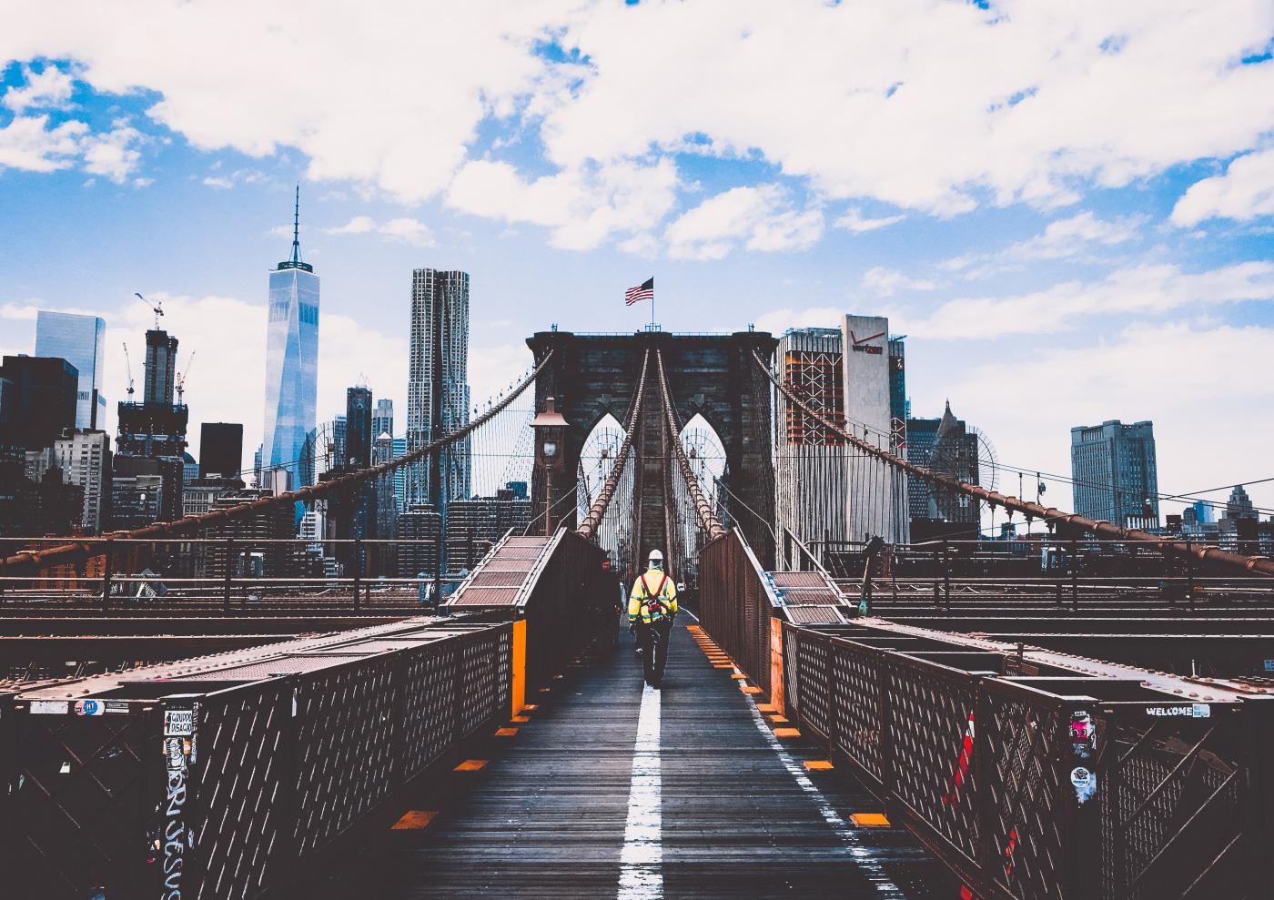 walking alone over brooklyn bridge